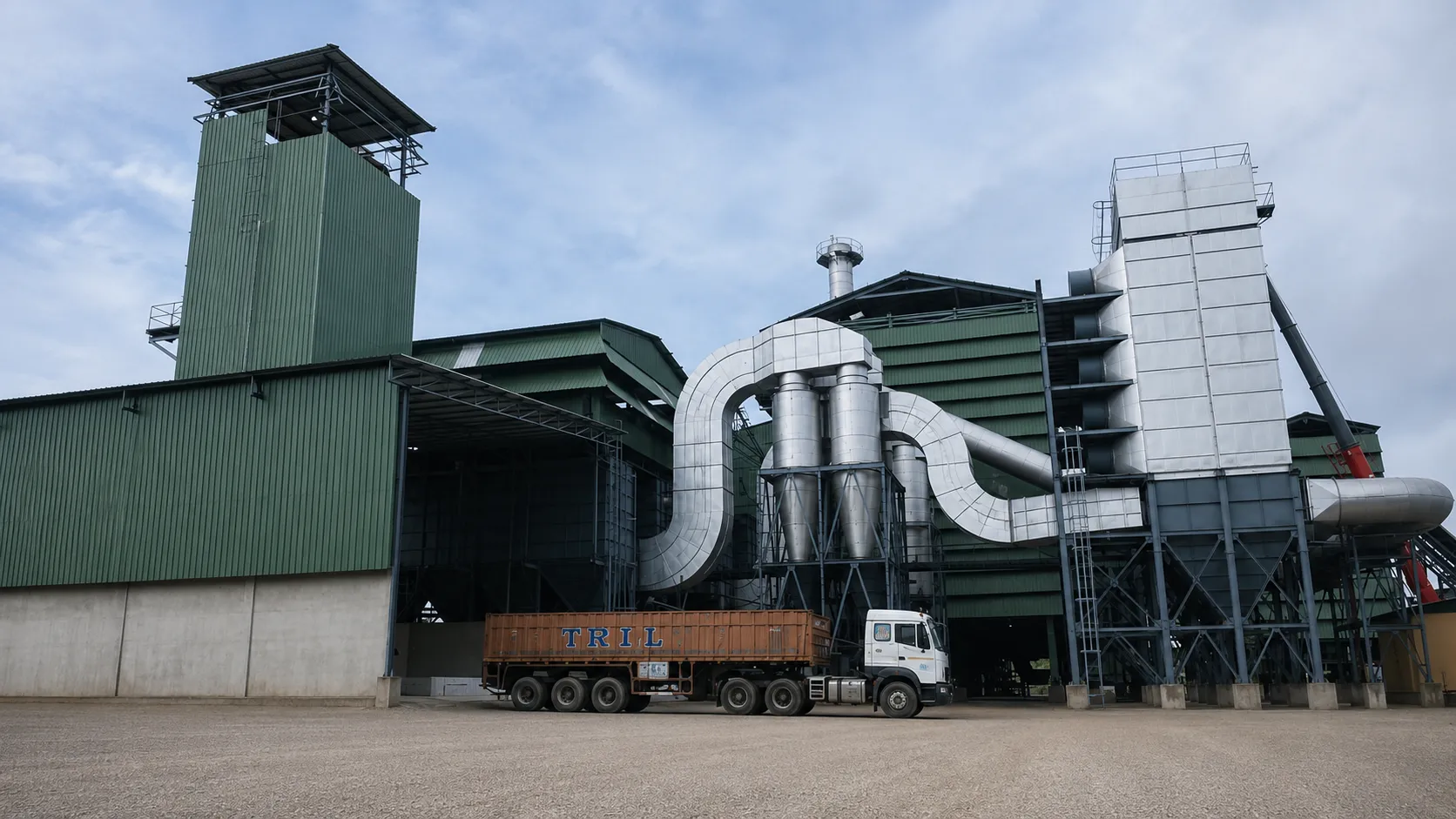 Aja Alloys factory exterior with plant infrastructure and transport truck